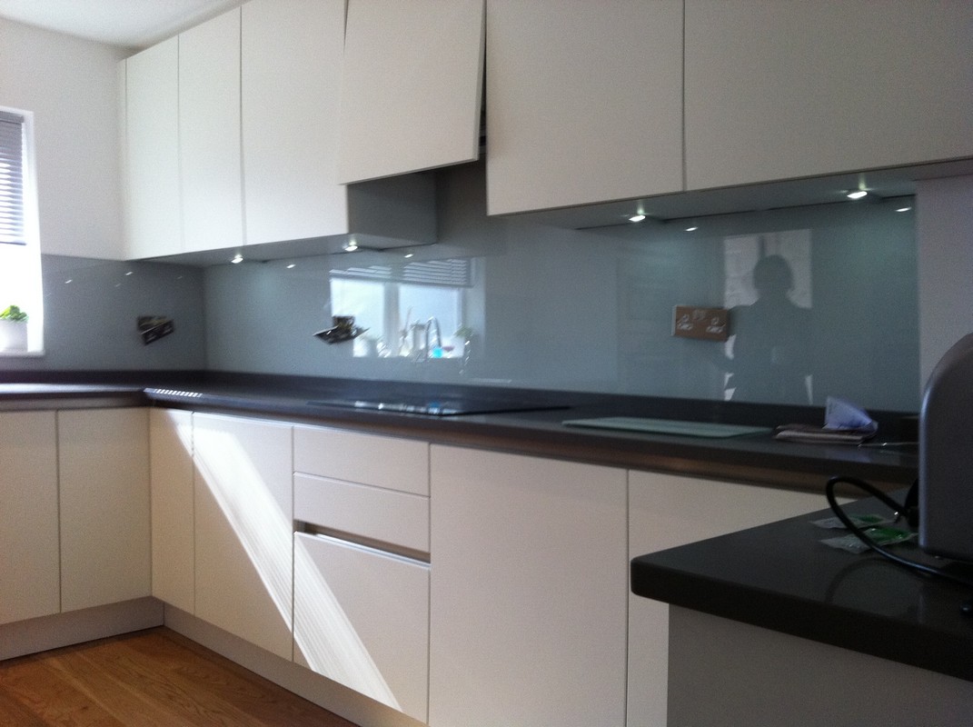 Grey glass kitchen splashback with LED lighting in Purley