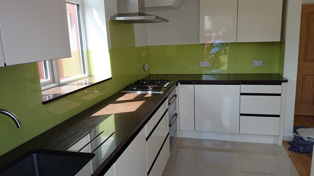 Lime green glass kitchen splashback installed by Purley glaziers