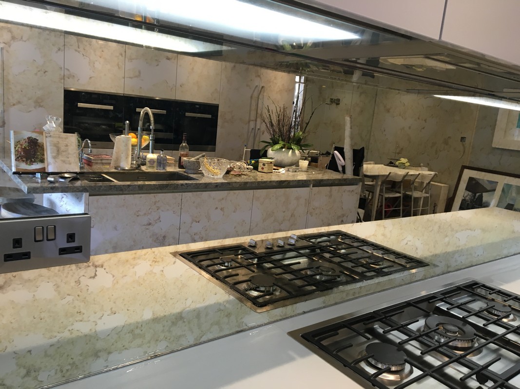 Mirror glass splashback in Purley luxury kitchen